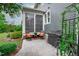 Cozy back patio with seating, a grill, and views of the landscaped backyard and the home's gray siding at 109 Big Timber Path, Holly Springs, NC 27540