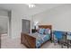 Guest bedroom with double bed, workspace and natural light at 109 Big Timber Path, Holly Springs, NC 27540