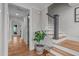Welcoming entryway with hardwood floors, staircase, and neutral paint at 109 Big Timber Path, Holly Springs, NC 27540