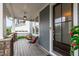Charming front porch features comfortable seating and a view of the neighborhood at 109 Big Timber Path, Holly Springs, NC 27540
