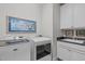 Laundry room with washer, dryer, built in cabinets, and sink at 109 Big Timber Path, Holly Springs, NC 27540