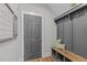 Functional mudroom with storage bench, hooks, and stylish decor at 109 Big Timber Path, Holly Springs, NC 27540