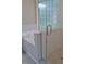 Bright bathroom features a luxurious tub and a glass-enclosed shower with stylish tile work at 1104 Barrow Nook Ct, Apex, NC 27502