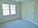 Cozy bedroom with natural light from the large window at 1104 Barrow Nook Ct, Apex, NC 27502