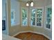 Breakfast nook with large windows and hardwood floors at 1104 Barrow Nook Ct, Apex, NC 27502