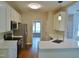 Spacious kitchen with stainless steel appliances, white cabinets and quartz counter at 1104 Barrow Nook Ct, Apex, NC 27502