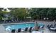 Community pool with lounge chairs and umbrellas offers a relaxing outdoor experience at 1104 Barrow Nook Ct, Apex, NC 27502