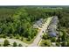 This aerial view shows the tree-lined street and neighborhood surrounding this home at 111 Chapel Run Way, Chapel Hill, NC 27517