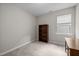 Cozy bedroom furnished with a bookcase and desk area beside a window with natural light at 111 Chapel Run Way, Chapel Hill, NC 27517