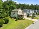 Charming two-story home with a well-manicured lawn and an attached garage at 111 Chapel Run Way, Chapel Hill, NC 27517