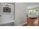 Welcoming foyer featuring coat hooks and a peek into a comfortably furnished living space at 111 Chapel Run Way, Chapel Hill, NC 27517