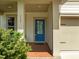 Inviting front porch with a stylish blue door and well-kept landscaping, creating a warm welcome at 111 Chapel Run Way, Chapel Hill, NC 27517