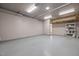Spacious garage with a smooth floor, offering ample room for vehicles and storage shelving at 111 Chapel Run Way, Chapel Hill, NC 27517