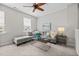 Inviting living room features neutral tones, plush seating, and a modern ceiling fan at 111 Chapel Run Way, Chapel Hill, NC 27517