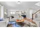 Open-concept living space showcasing living room, dining area, and kitchen with modern decor and finishes at 111 Chapel Run Way, Chapel Hill, NC 27517