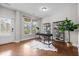 Bright office space with hardwood floors, a modern desk, and large windows offering serene views at 111 Chapel Run Way, Chapel Hill, NC 27517