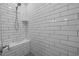 Modern shower with subway tile surround, built-in bench, and sleek shower head at 111 Chapel Run Way, Chapel Hill, NC 27517