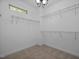 Walk-in closet with ample shelving and a minimalist design at 111 Chapel Run Way, Chapel Hill, NC 27517