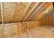 Unfinished attic space, showing framing with exposed beams and plywood sheathing at 111 Streamside Dr, Sanford, NC 27330