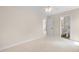 Carpeted bedroom featuring an ensuite bathroom and neutral wall color at 111 Streamside Dr, Sanford, NC 27330