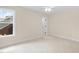 Spacious bedroom with carpet, ceiling fan, and natural light from the large window at 111 Streamside Dr, Sanford, NC 27330