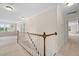 Open hallway with carpet, white trim, and views of other rooms at 111 Streamside Dr, Sanford, NC 27330