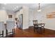Open kitchen with stainless steel appliances, bar stool seating, and an eat-in dining table, great for entertaining at 111 Streamside Dr, Sanford, NC 27330