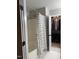 Clean bathroom featuring a shower-tub combo and an open closet with lots of storage space at 112 Fairford Dr, Holly Springs, NC 27540