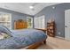 Bright bedroom with vaulted ceiling, large windows, and a cozy atmosphere at 112 Fairford Dr, Holly Springs, NC 27540