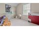Bedroom with an ironing board, lamps, and boxes, showcasing the room's potential for storage or customization at 112 Fairford Dr, Holly Springs, NC 27540