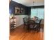 Charming dining room with wainscoting, stylish light fixture, and a convenient wine rack at 112 Fairford Dr, Holly Springs, NC 27540