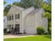 Charming two-story home with an attached garage and a well-maintained lawn at 112 Fairford Dr, Holly Springs, NC 27540