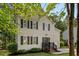Charming two-story home with black shutters, landscaped yard, and a welcoming front porch at 112 Fairford Dr, Holly Springs, NC 27540