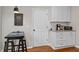 Cozy kitchen area with white cabinets, granite countertops, and essential appliances at 112 Fairford Dr, Holly Springs, NC 27540