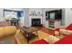 Cozy living room with a fireplace, TV, and comfortable seating at 112 Fairford Dr, Holly Springs, NC 27540
