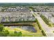 Aerial view highlights houses with waterfront views at 113 Mazarin Ln, Cary, NC 27519