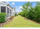 Picturesque backyard featuring lush green grass, mature trees, and well-maintained landscaping at 113 Mazarin Ln, Cary, NC 27519
