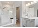 Bathroom showcasing tiled walk-in shower with bench, vanity, modern fixtures, and decorative patterned floor at 113 Mazarin Ln, Cary, NC 27519