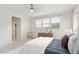 Bright bedroom featuring large windows, white walls and neutral decor at 113 Mazarin Ln, Cary, NC 27519