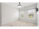 Bedroom with neutral carpet, two windows bringing in natural light, and a modern ceiling fan at 113 Mazarin Ln, Cary, NC 27519
