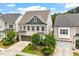 Attractive two-story home with light brick, two-car garage, and professionally landscaped yard at 113 Mazarin Ln, Cary, NC 27519
