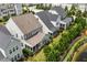 The back of these gray homes features screened-in porches with lovely landscaping at 113 Mazarin Ln, Cary, NC 27519