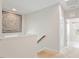 Bright hallway with carpet and white walls featuring decorative artwork, and an open floorplan at 113 Mazarin Ln, Cary, NC 27519