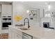 Kitchen featuring a gray center island with granite countertops and stainless steel appliances, and open shelves at 113 Mazarin Ln, Cary, NC 27519