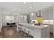Kitchen featuring center island, granite countertops, stainless steel appliances, and seating at 113 Mazarin Ln, Cary, NC 27519
