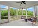 Relaxing screened porch with comfortable seating and views of the lush backyard at 113 Mazarin Ln, Cary, NC 27519