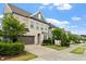 Pleasant street view featuring lush front yards, two-story homes, and a tree-lined sidewalk at 113 Mazarin Ln, Cary, NC 27519