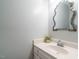 Neat bathroom features an oval sink, decorative mirror, and a plant for a touch of nature at 114 Oxpens Rd, Cary, NC 27513
