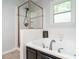 Inviting bathroom includes a glass enclosed shower and a soaking tub with modern fixtures at 114 Oxpens Rd, Cary, NC 27513