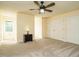 Spacious bedroom with two large closets, neutral carpet, and a ceiling fan at 114 Oxpens Rd, Cary, NC 27513